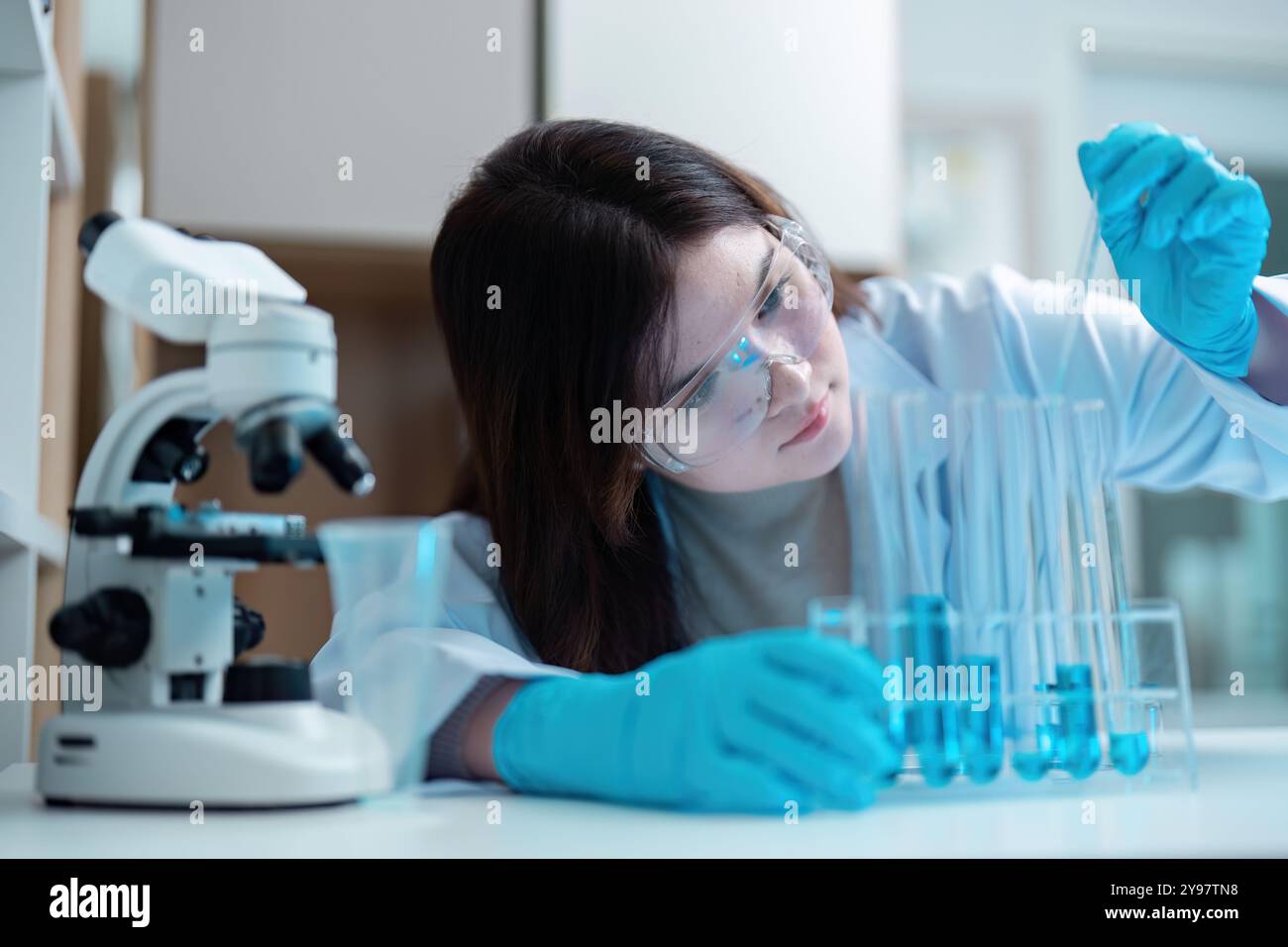 Scientist Conducting Experiment in Modern Laboratory with Advanced ...