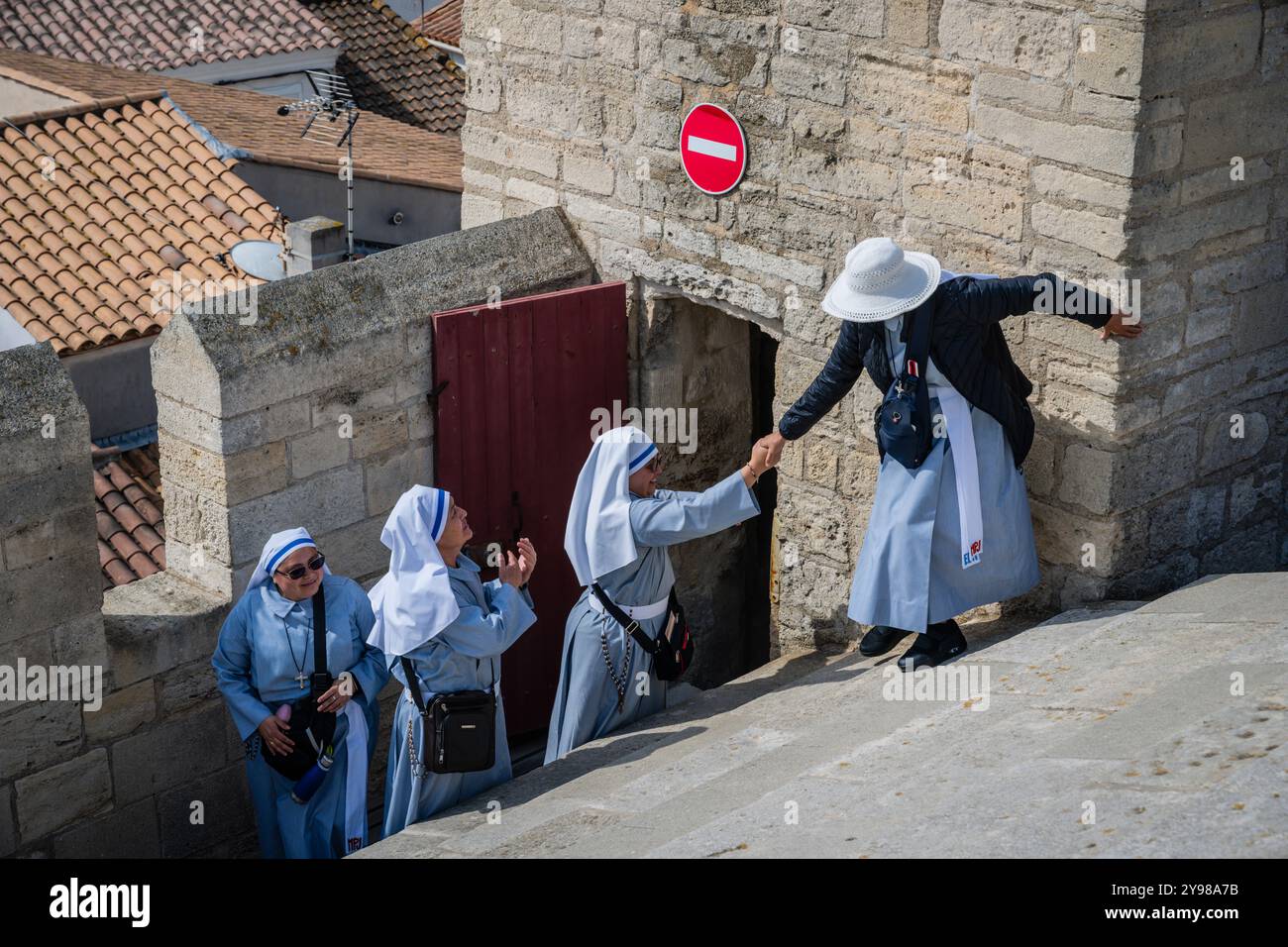 Nuns having a little vacation on the roof, Church of Notre Dame, Saintes Maries de la Mer, Camargue, Bouches-du-Rhone, Provence, France. Stock Photo