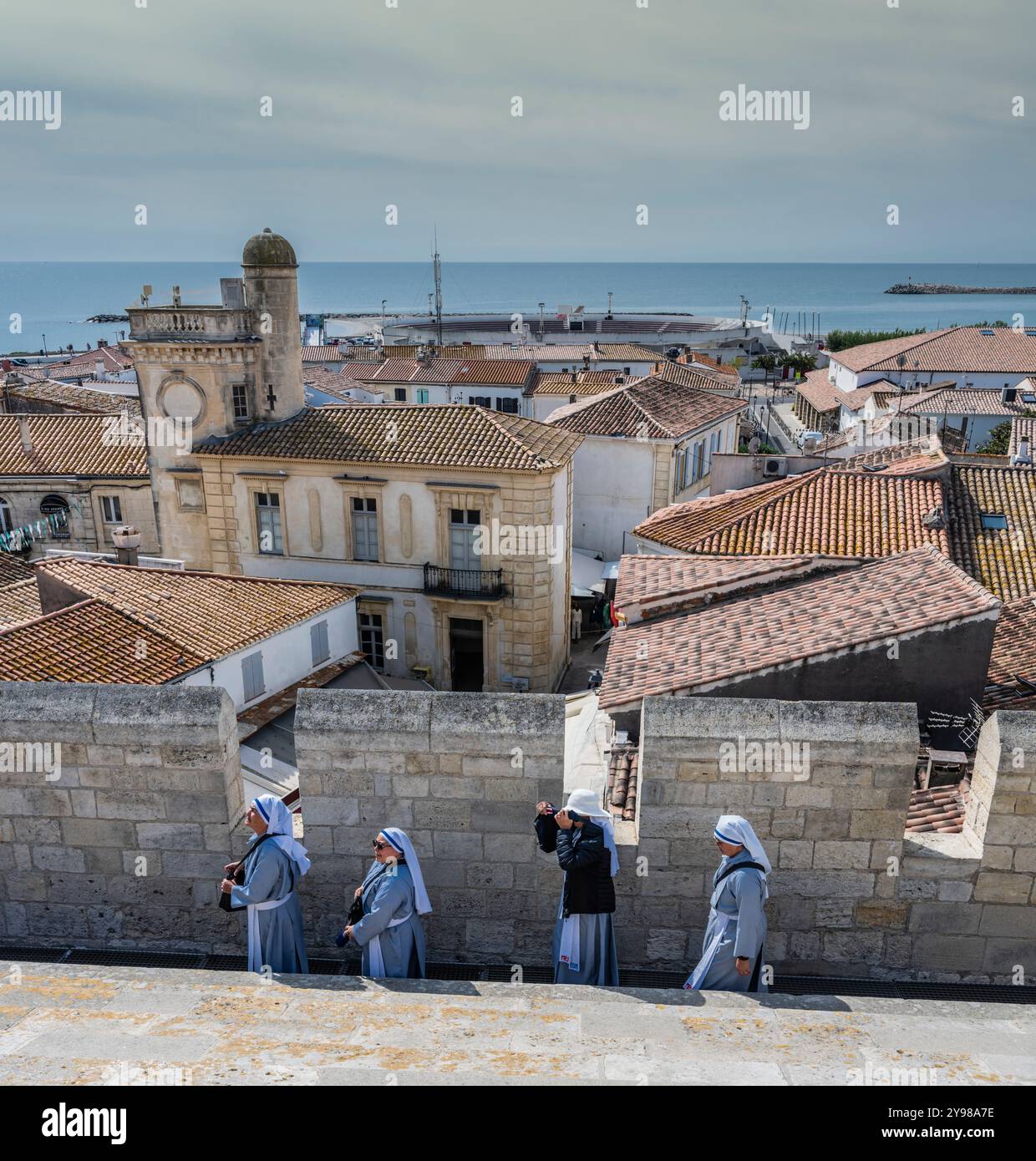 Nuns having a little vacation on the roof, Church of Notre Dame, Saintes Maries de la Mer, Camargue, Bouches-du-Rhone, Provence, France. Stock Photo