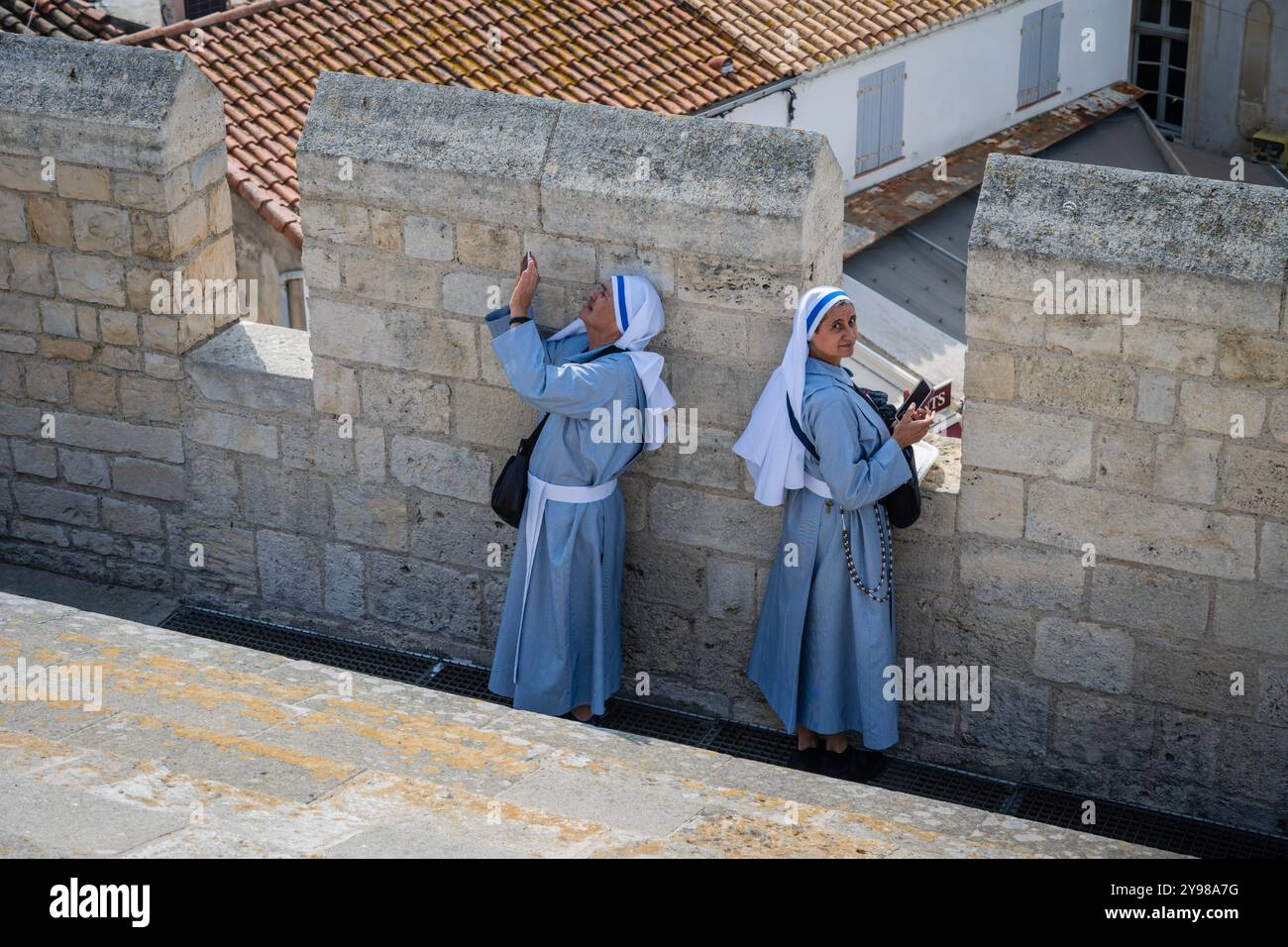 Nuns having a little vacation on the roof, Church of Notre Dame, Saintes Maries de la Mer, Camargue, Bouches-du-Rhone, Provence, France. Stock Photo