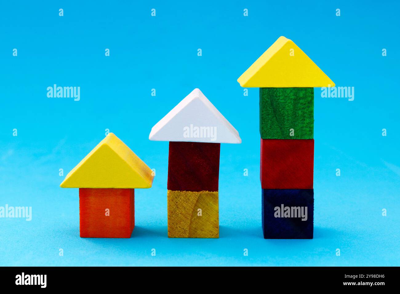 Colorful wooden figures forming a bar graph Stock Photo - Alamy