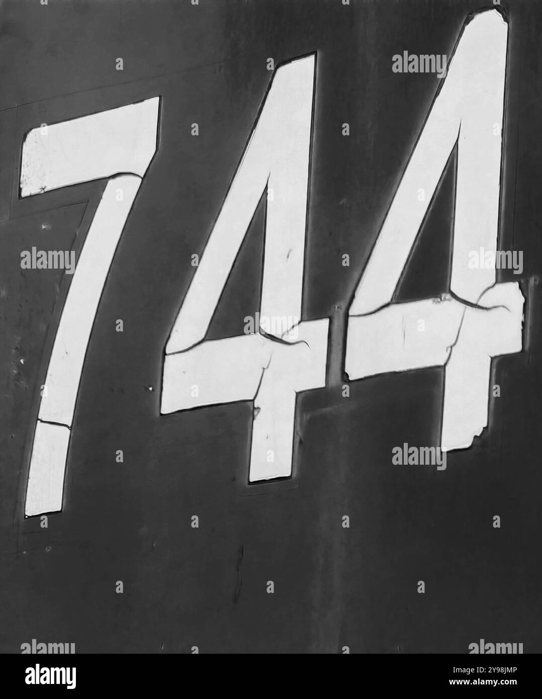 Number 744: Bold White Symbols on a Black Background Stock Photo