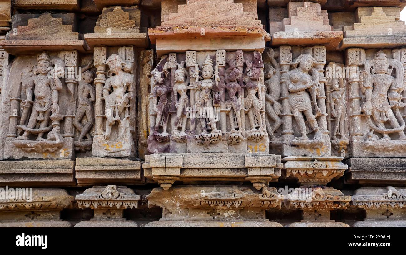 Carved sculptures of Hindu deities on the side panel of Shri Harsiddhi Mata Temple, Sunak, Mehsana, Gujarat, India. Stock Photo