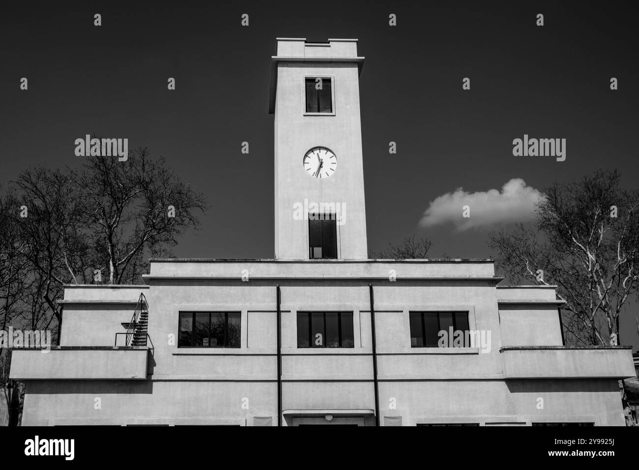 tower with clock architectural construction with clock 40s italy vintage building with blue sky Stock Photo