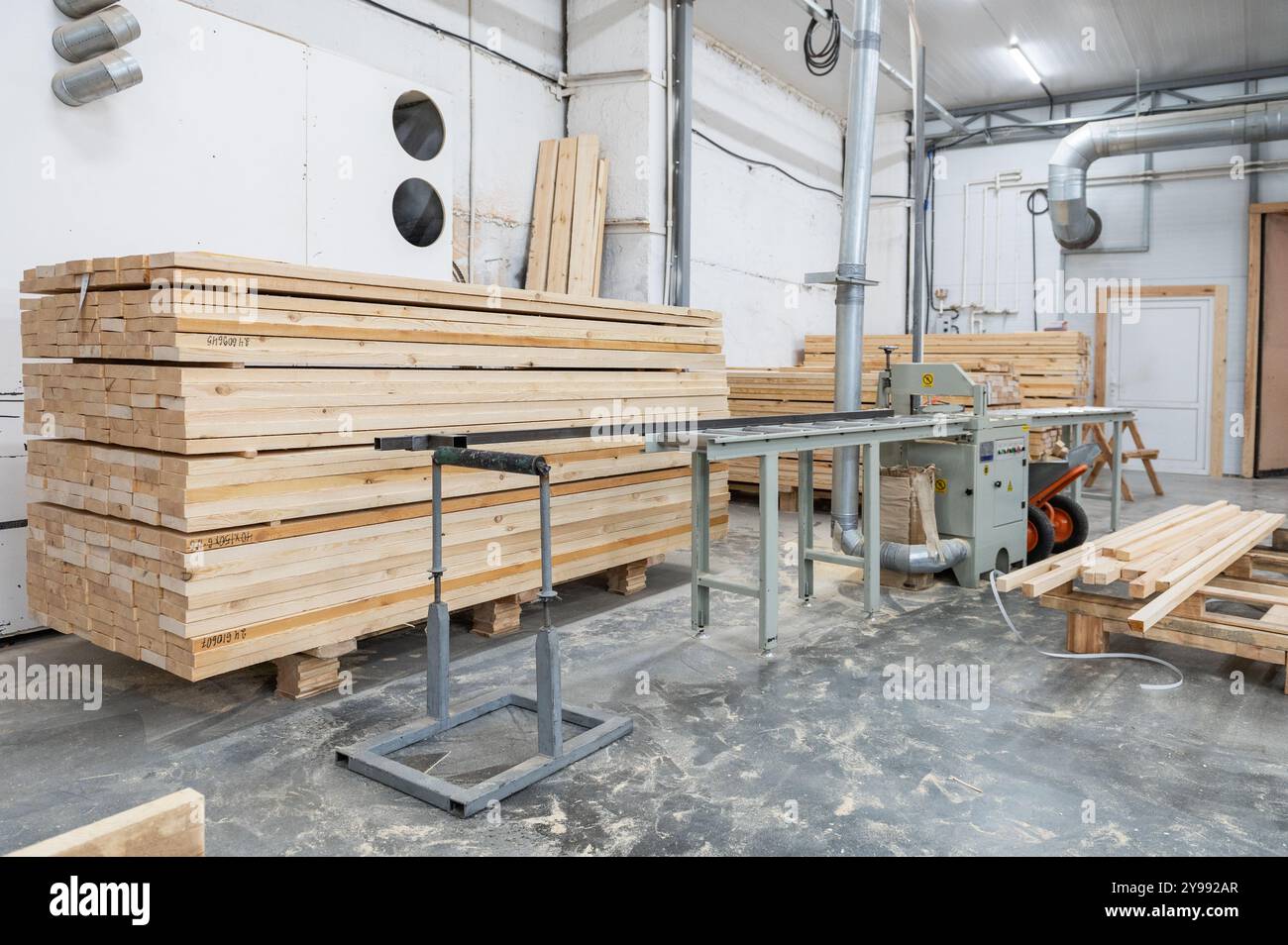 Stacked wooden planks close-up at lumber warehouse. Wood industry ...