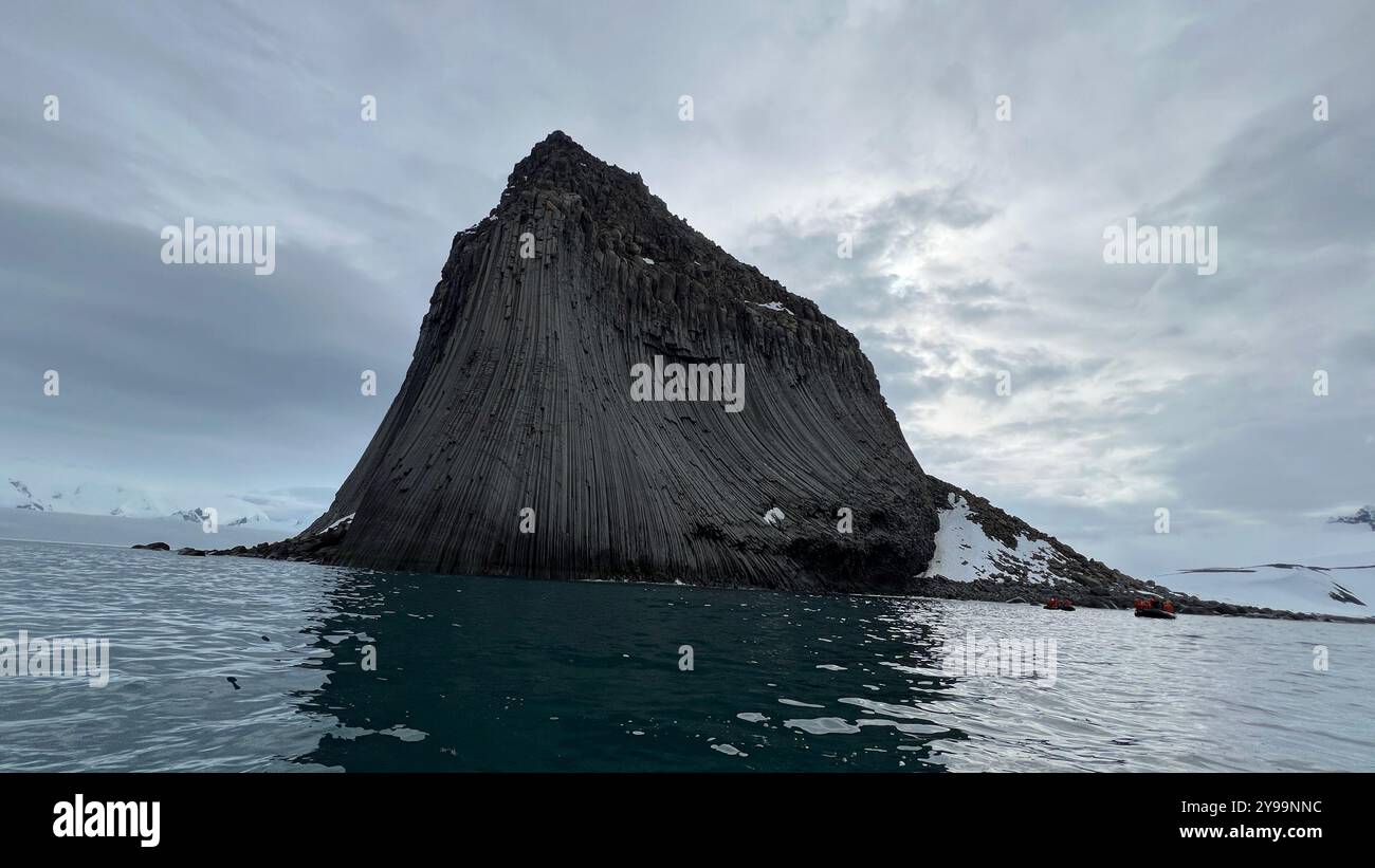 Edinburgh Rock, Antarctica: a towering geological wonder rising from icy waters, showcasing rugged beauty and untouched polar wilderness. - Smartphone Captured Stock Image