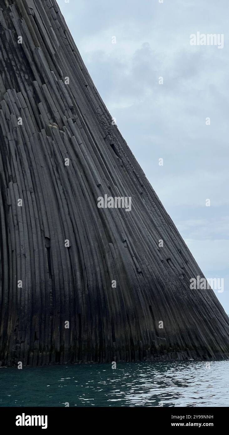 Edinburgh Rock, Antarctica: a towering geological wonder rising from icy waters, showcasing rugged beauty and untouched polar wilderness. - Smartphone Captured Stock Image