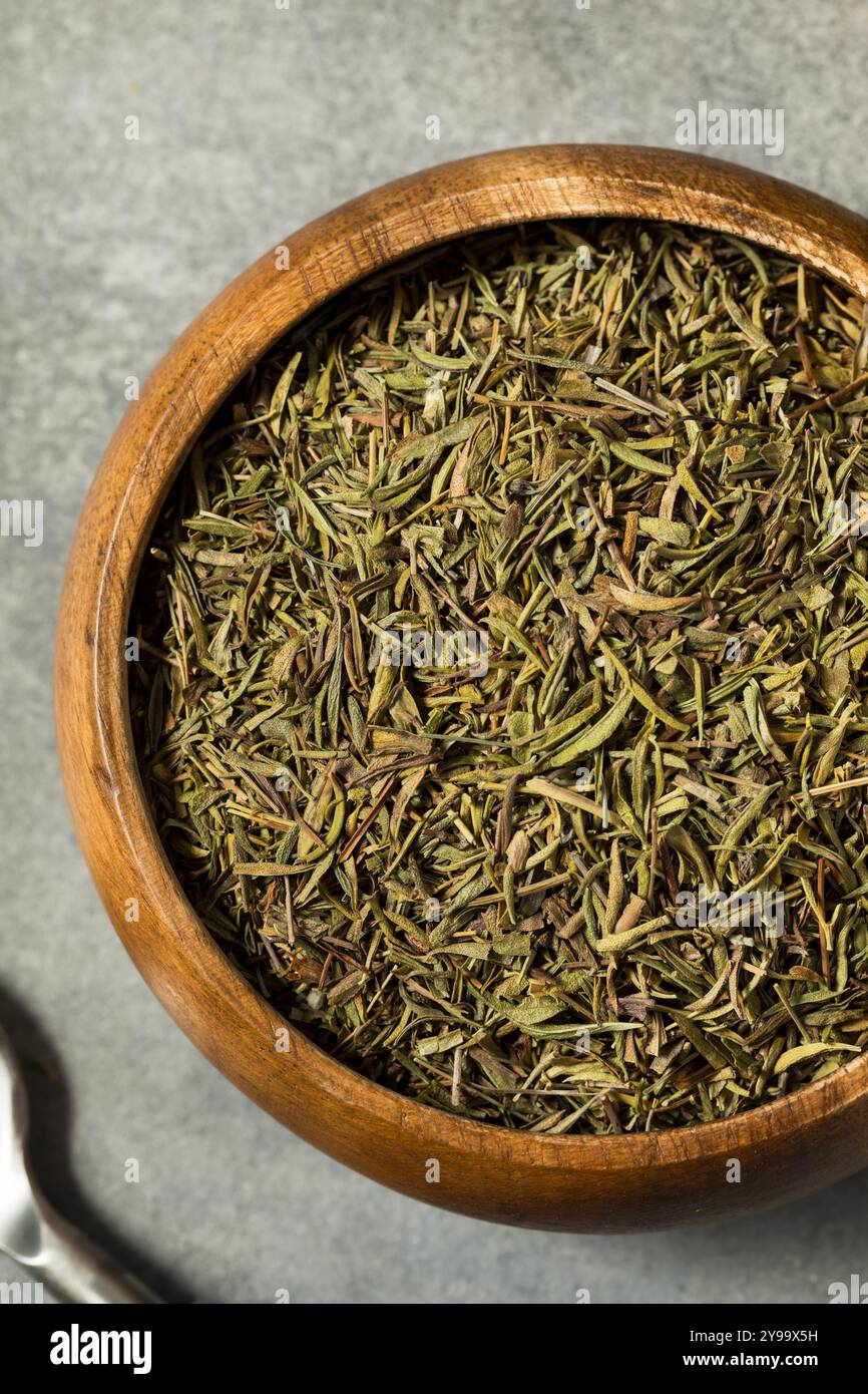 Organic Raw Dry Savory Herbs in a Bowl for Cooking Stock Photo