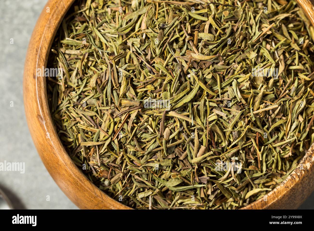 Organic Raw Dry Savory Herbs in a Bowl for Cooking Stock Photo