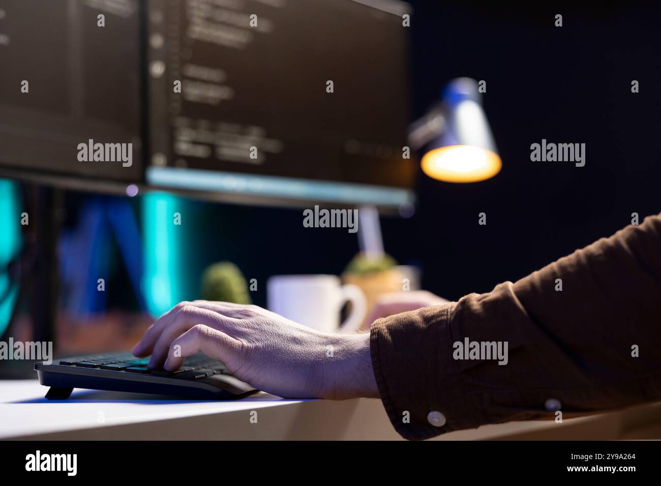 Freelancing computer technician futureproofing company network from downtimes and unexpected system failures. Tech support admin typing on keyboard, increasing data security, close up Stock Photo