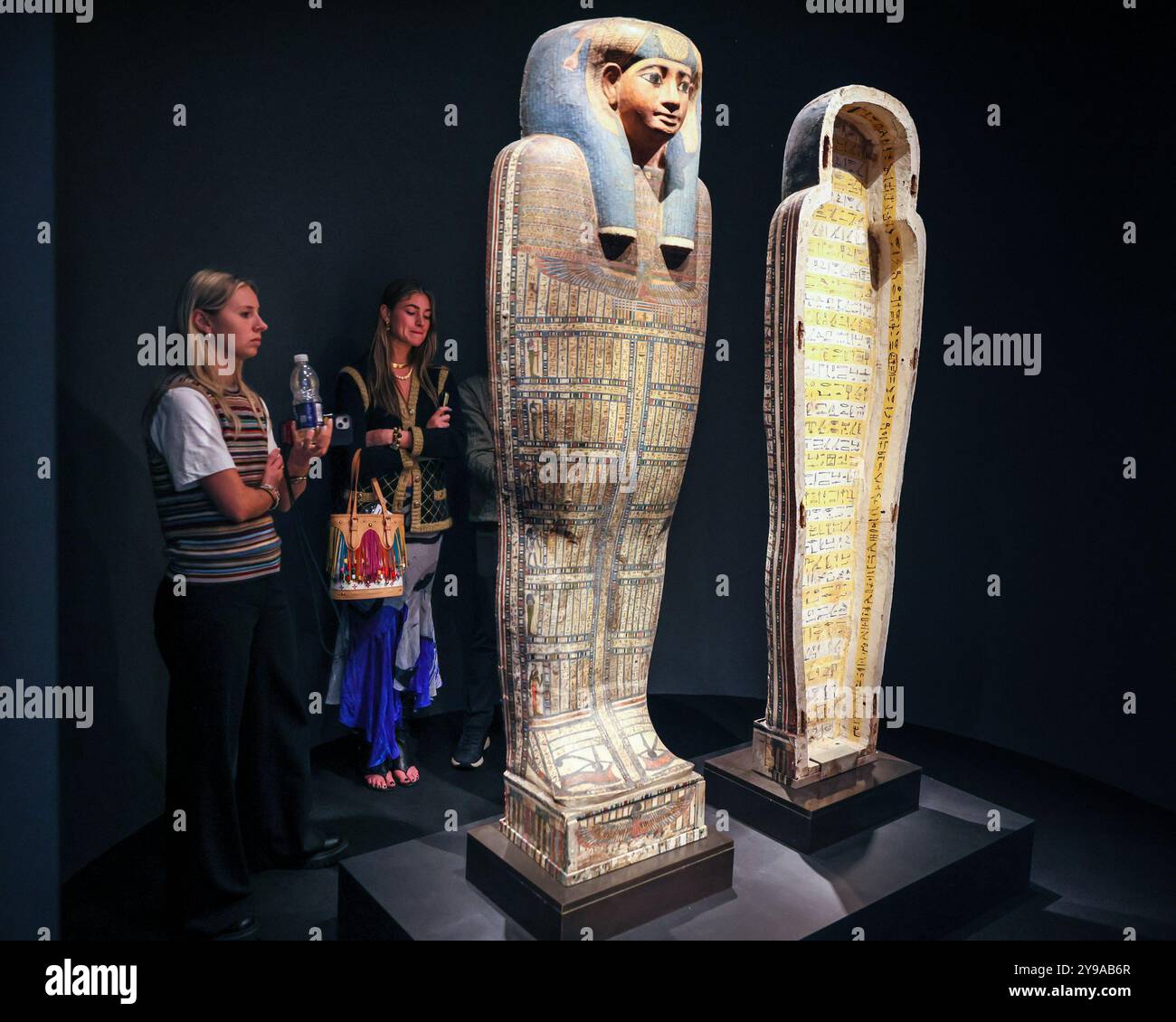 London, UK. 09th Oct, 2024. Visitors look at The Forgotten Princess, The Inner Sarcophagus of Princess Sopdet-em-haawt', Late 25th-Early 26th Dynasty Egypt at David Aaron. Frieze Masters preview day. Frieze Masters gives a unique view on the relationship between historical art and contemporary practice, showing work made before the year 2000 whereas Frieze London presents work created mainly post-2000. Credit: Imageplotter/Alamy Live News Stock Photo