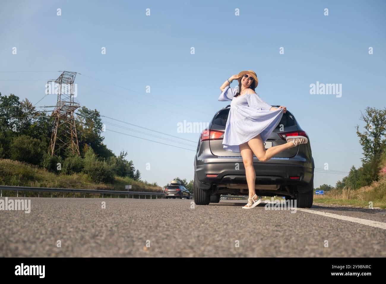 Beautiful woman posing car hi-res stock photography and images - Alamy
