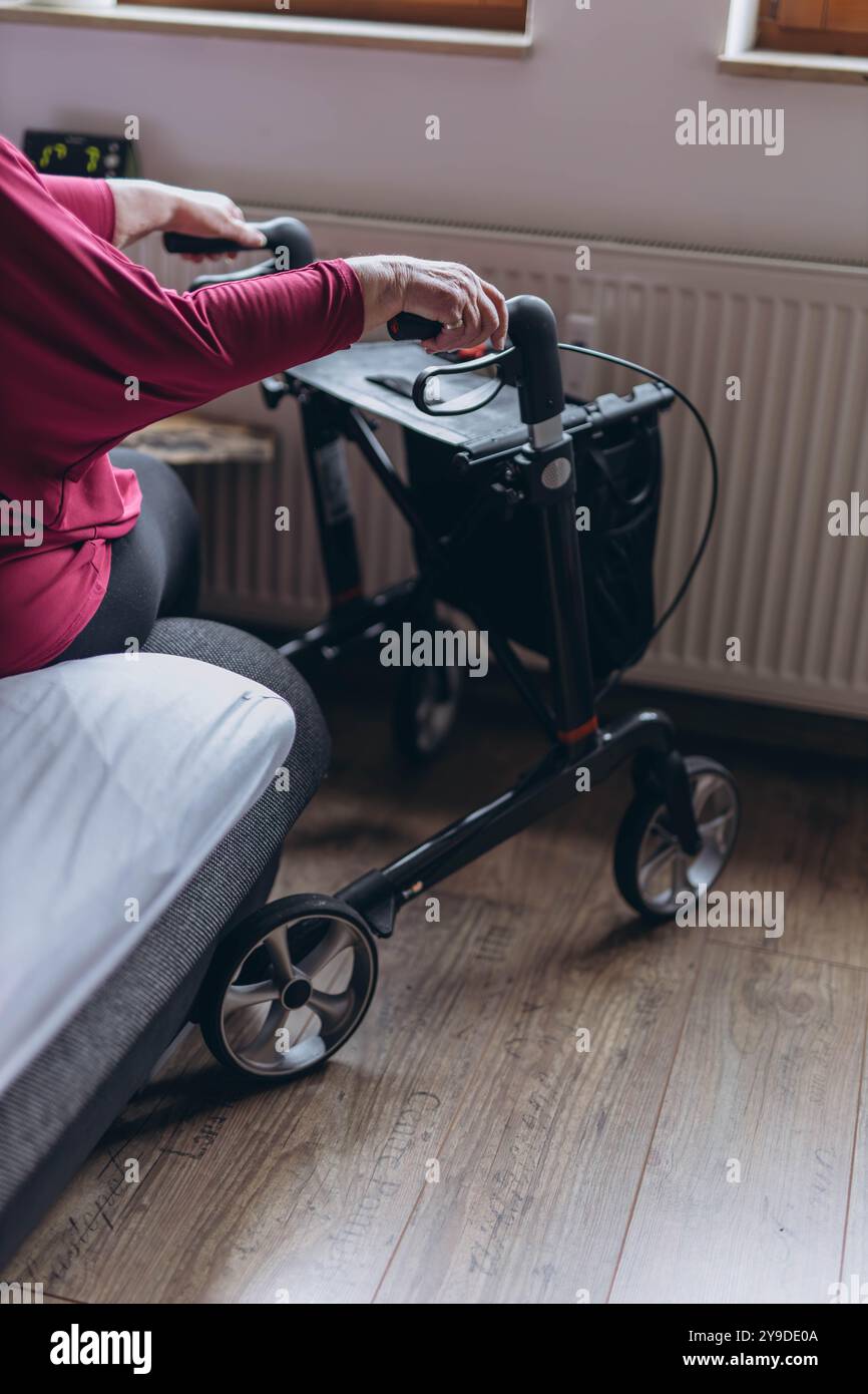 Elderly woman walker looks home hi-res stock photography and images - Alamy