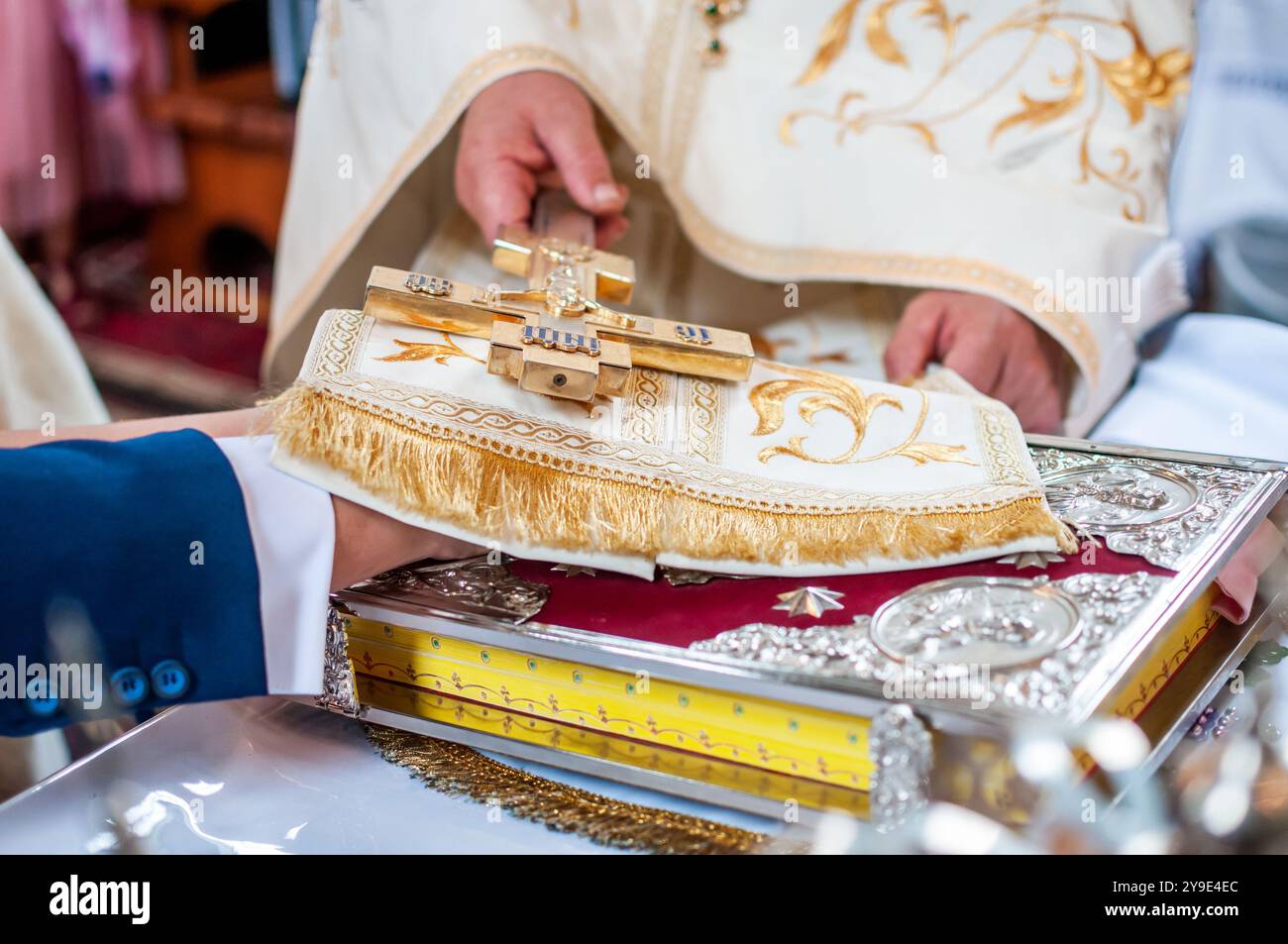 Ritual Exchange of a Golden Cross in a Traditional Ceremony Stock Photo ...