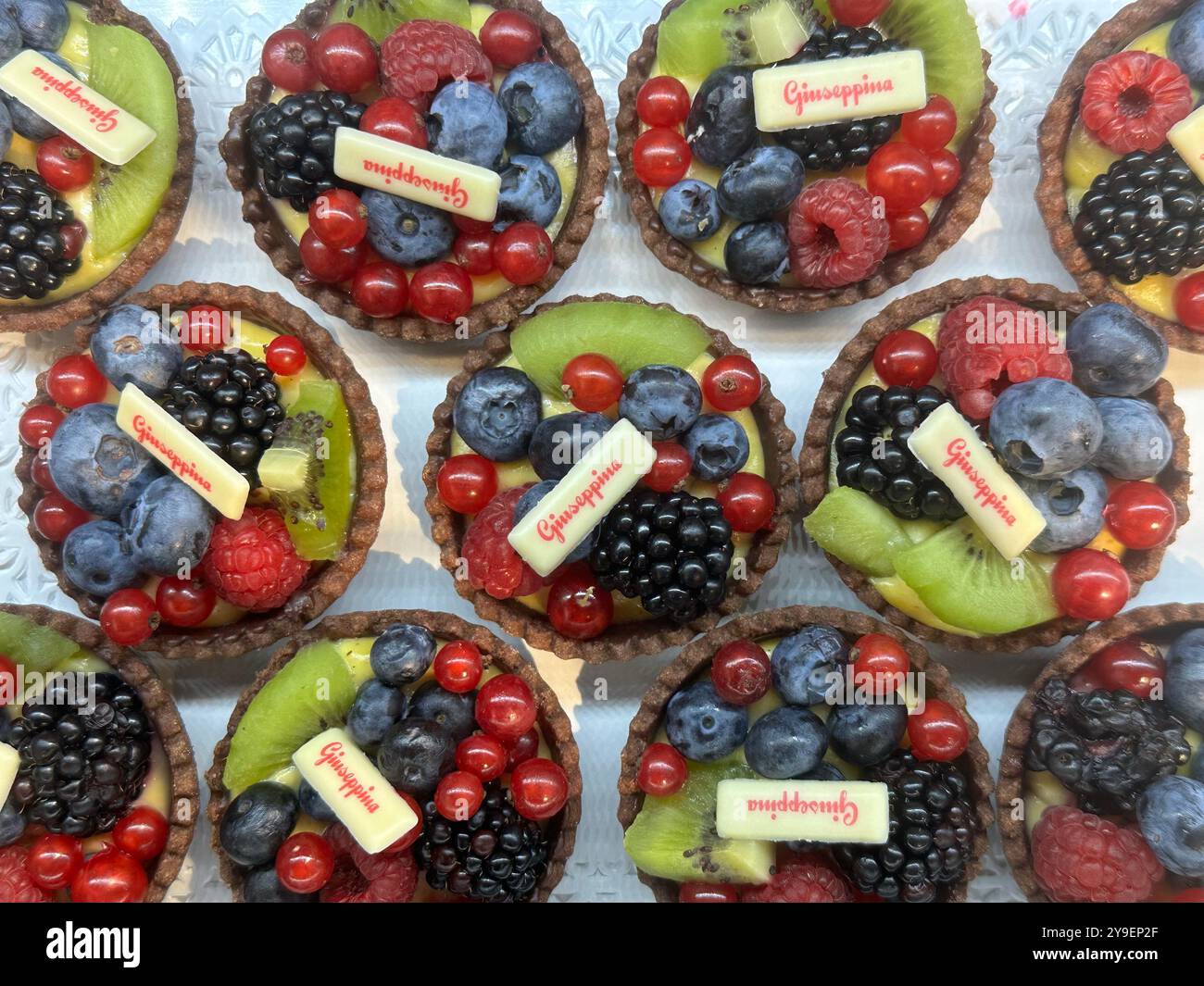 Colorful desserts with blueberries and kiwi at the bar - Smartphone Captured Stock Image