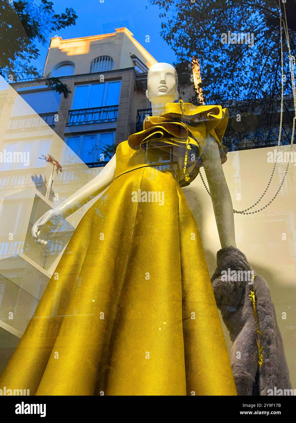 Mannequin wearing evening dress in a shop window. Madrid, Spain. - Smartphone Captured Stock Image