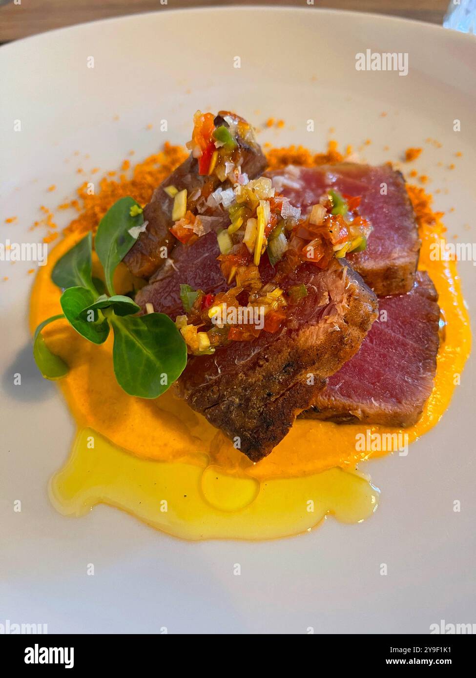 Red tuna loin with vegetables. Spain. Stock Photo