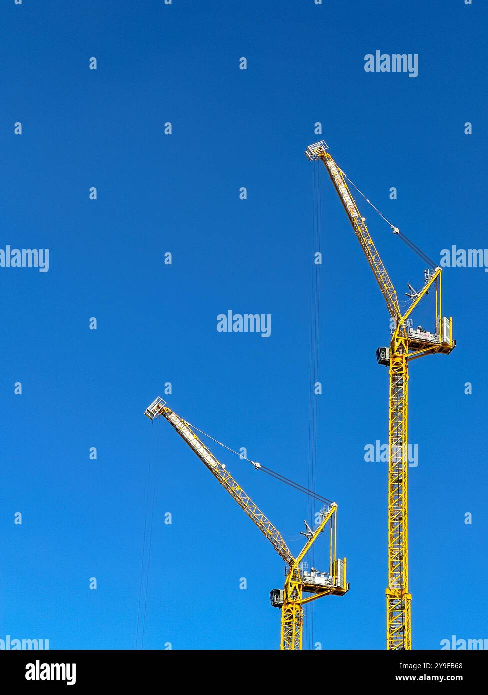 Cardiff, Wales UK - 16 August 2024: Wide angle view of tower cranes on a construction site in Cardiff city centre - Smartphone Captured Stock Image