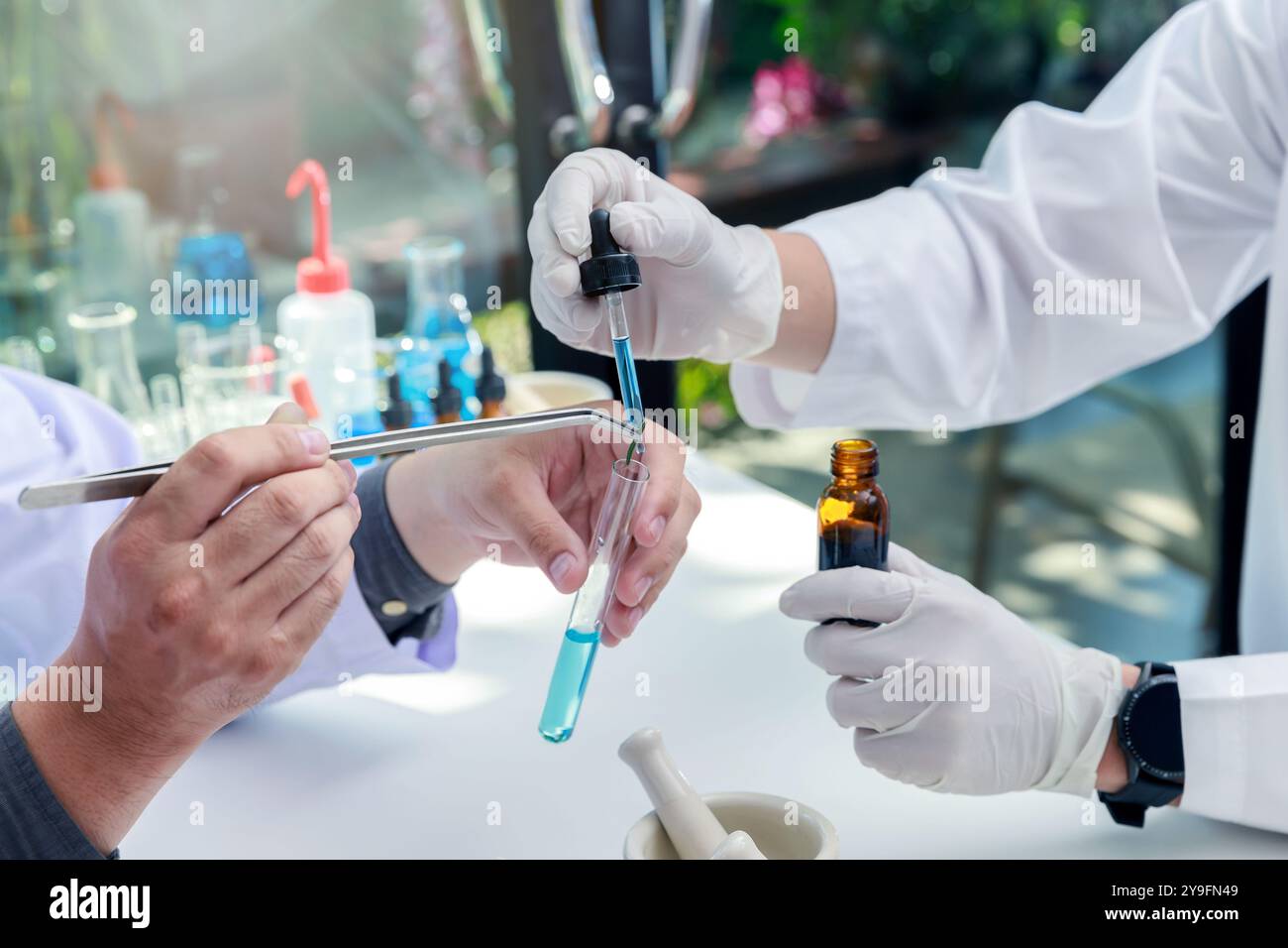 Team of researcher or scientists working in laboratory. Researcher or scientists working in laboratory. Researchers are inventing vaccines or medicine Stock Photo
