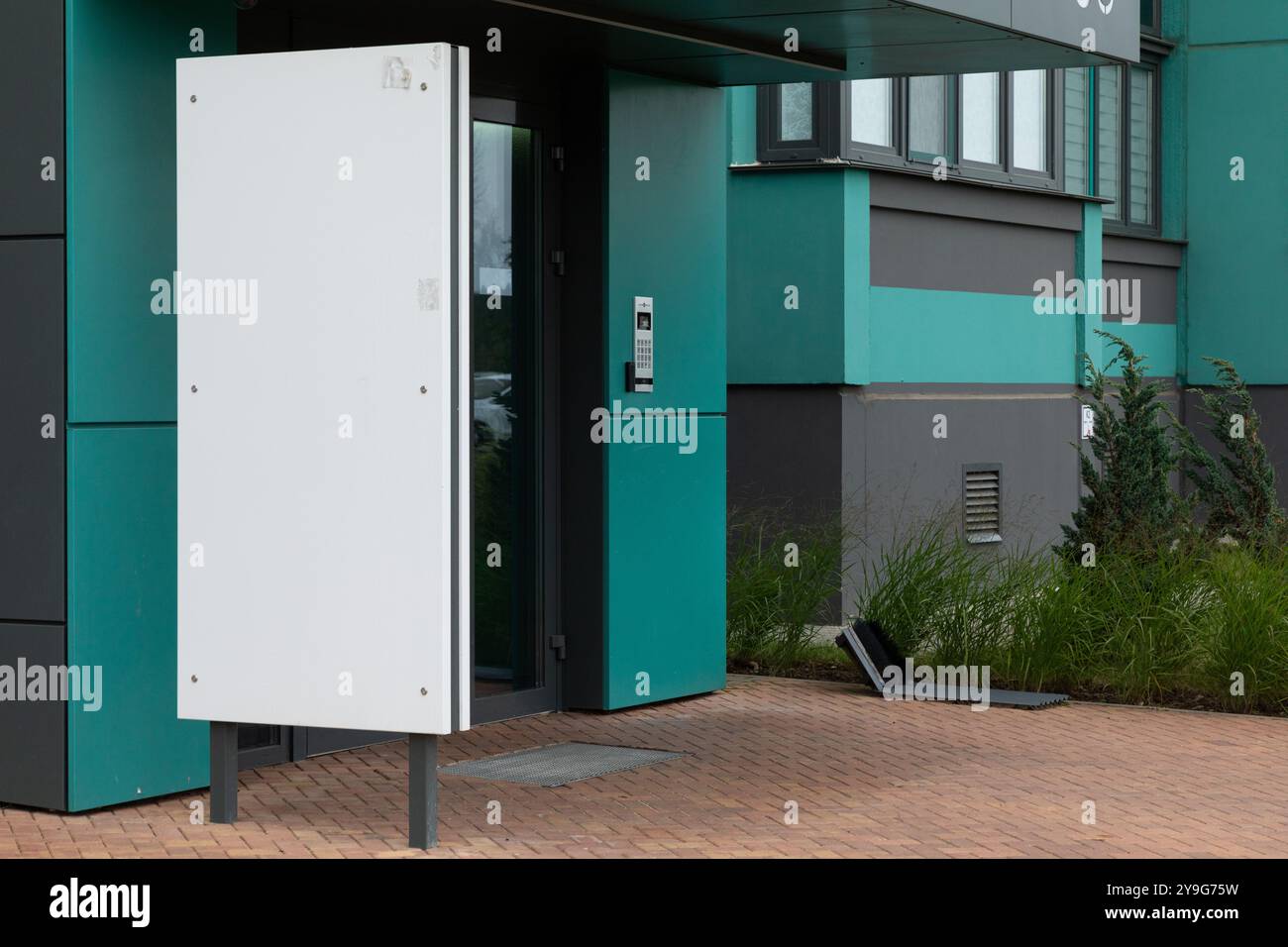 Modern high-rise apartment buildings with sleek design and an entrance ...