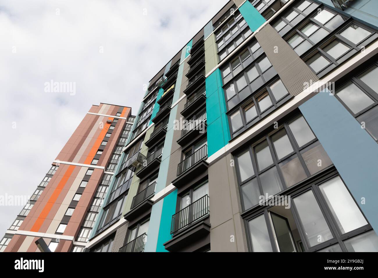 Modern apartment buildings and urban park with stone water featu ... - Contemporary High-Rise Apartment Buildings