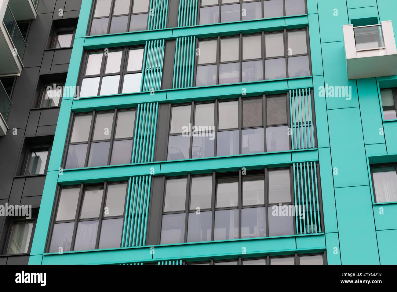 A modern high rise apartment building against a vibrant and colorful ... - Contemporary High-Rise Apartment Buildings