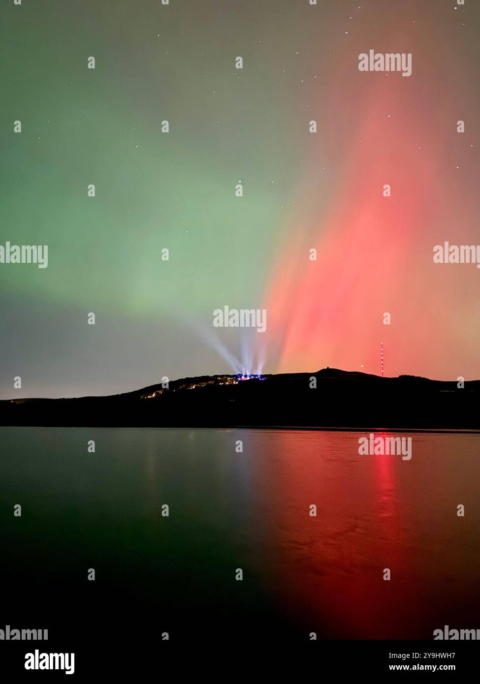 Aurora Borealis (Northern Lights) over Rivington near Chorley in Lancashire. Also showing lights from Rivington festival of light. - Smartphone Captured Stock Image