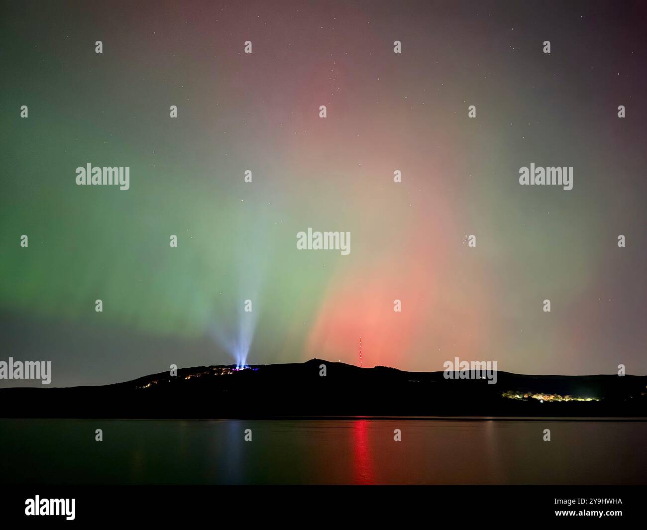 Aurora Borealis (Northern Lights) over Rivington near Chorley in Lancashire. Also showing lights from Rivington festival of light. - Smartphone Captured Stock Image