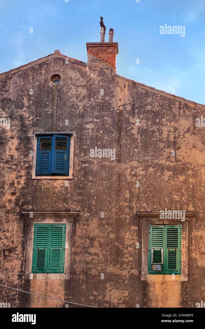 Shuttered windows in stone building in the Old Town of Dubrovnik, Croatia - Smartphone Captured Stock Image