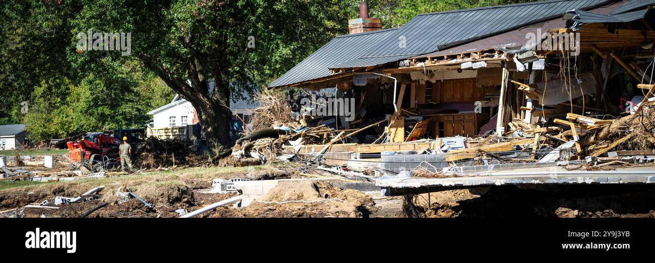 A home sits in ruin after severe flooding from Hurricane Helene caused devastating damage to the surrounding area, Erwin, Tennessee, Oct. 9, 2024. National Guard members were deployed from across Tennessee following flooding from the storm to support local authorities with recovery efforts in the affected area. (U.S. Air National Guard photo by Senior Airman Ben Cash) Stock Photo