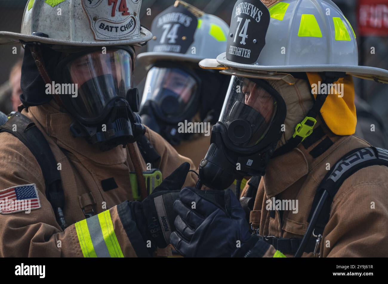 From left, Michael Melson, 316th Civil Engineer Squadron battalion chief, and U.S. Air Force Col. Jun S. Oh, 316th Wing and installation commander, perform an equipment check at Joint Base Andrews, Md., Oct. 7, 2024. Melson secured the breathing apparatus as part of buddy system pre-checks prior to engaging fire dynamics training during Fire Prevention Week. (U.S. Air Force photo by Staff Sgt. Alex Broome) Stock Photo