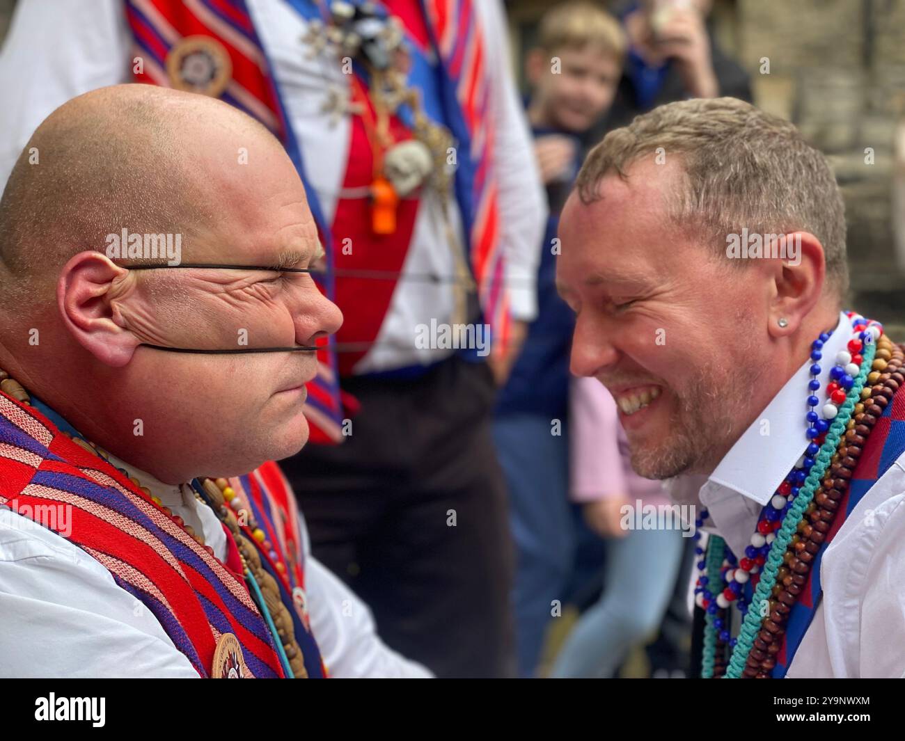 Famous ear wrestling contest, Saddleworth Morris men, Rushcart festival, August 2023, Saddleworth, Greater Manchester, U.K. - Smartphone Captured Stock Image