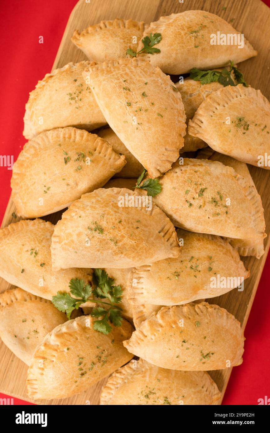Meat Pies Stacked on a cutting board Stock Photo