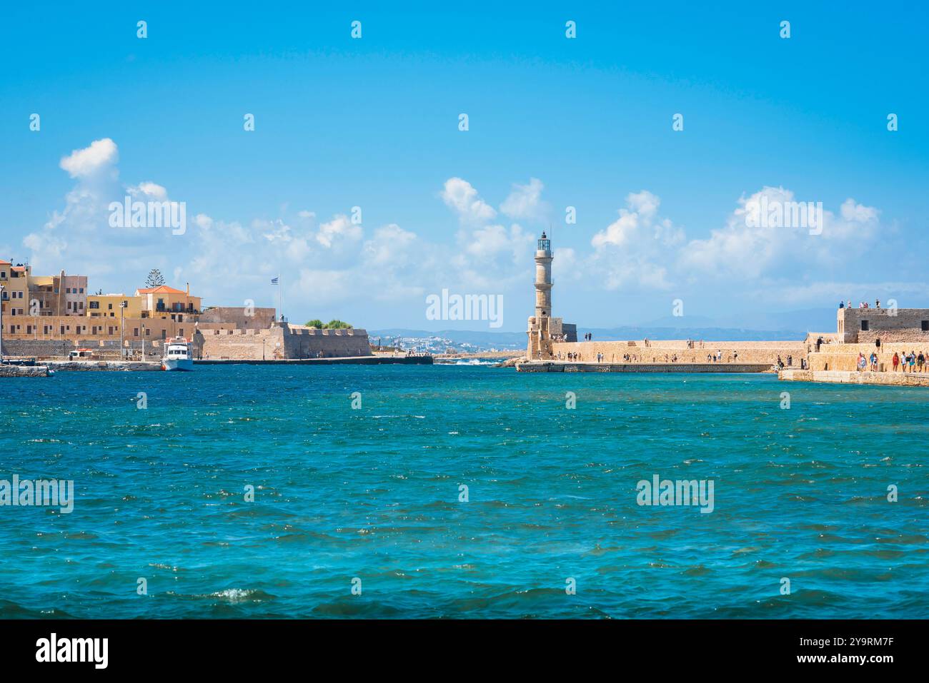 Hania Crete harbour, view of the Inner Harbour and historic lighthouse in the Venetian old town area of Chania, Crete, Greece Stock Photo