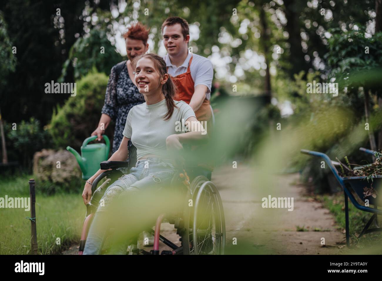 Joyful outdoor activity with girl in wheelchair and friends Stock Photo ...
