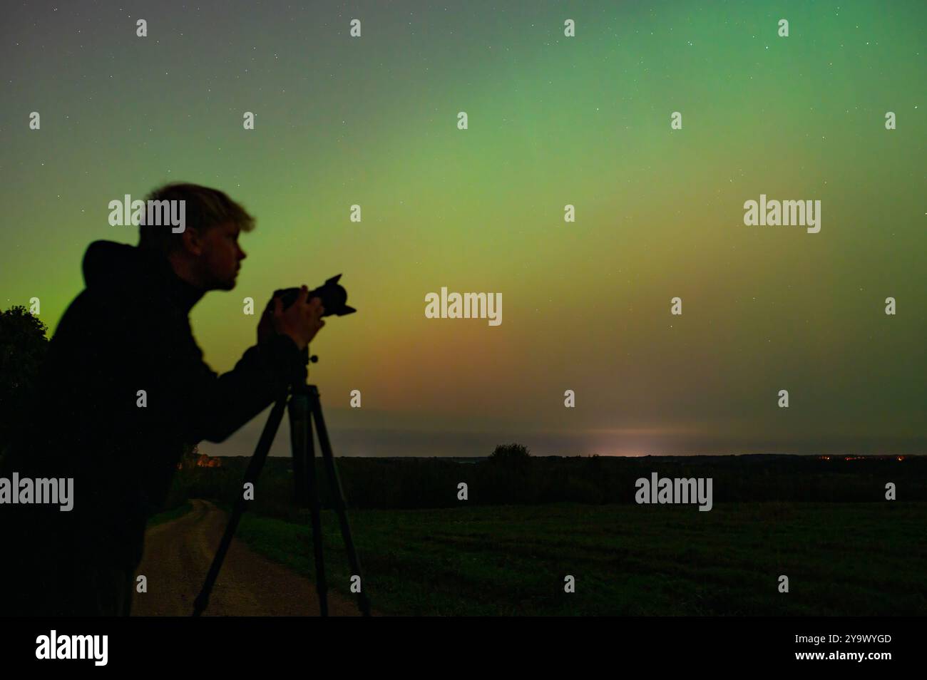 World Photography Day. Photographer with his camera and tripod taking