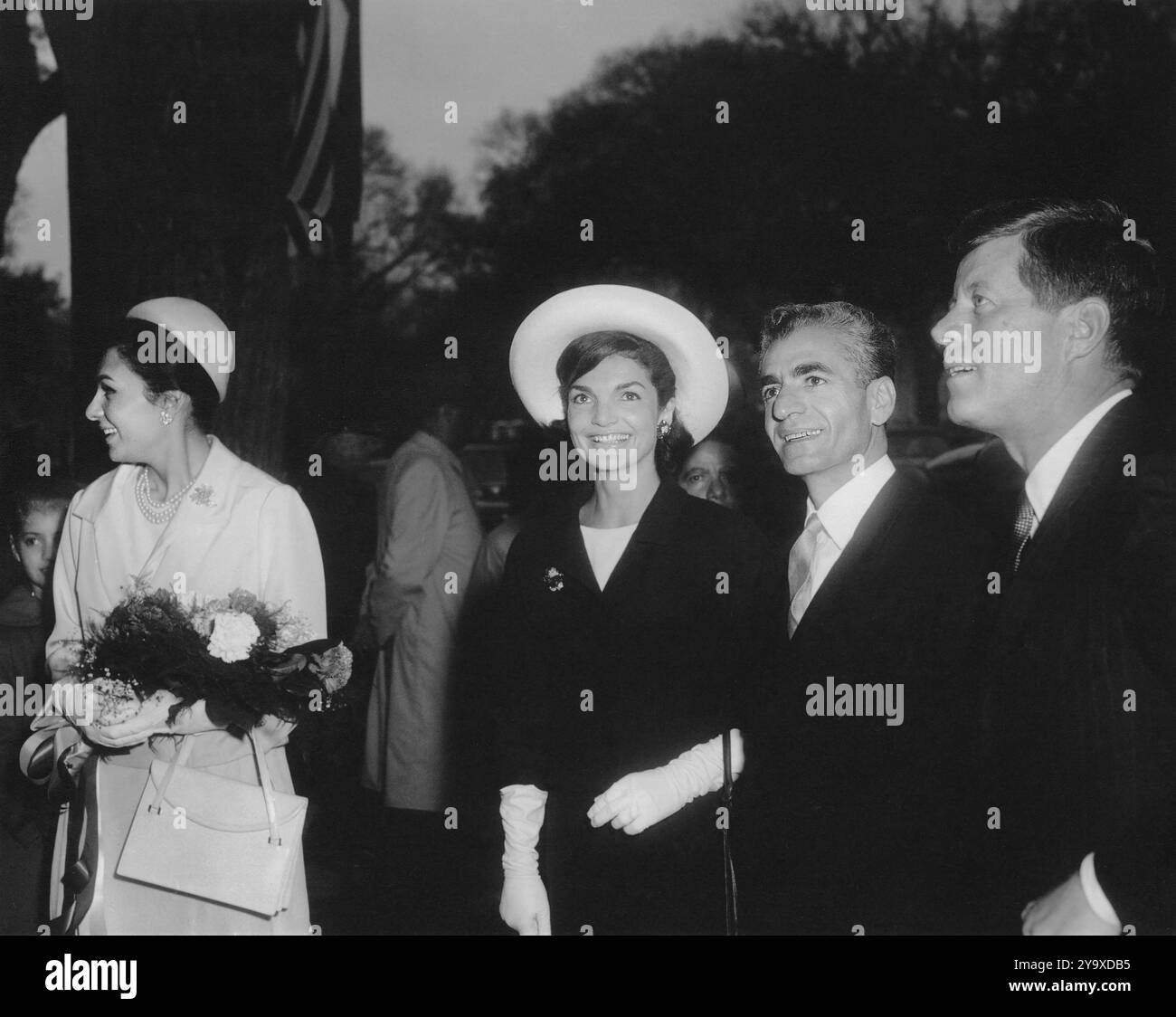 Empress Farah Pahlavi, U.S. First Lady Jacqueline Kennedy, Mohammad Reza Pahlavi, Shah of Iran and U.S. President John Kennedy arriving at Blair House, Washington, D.C., USA, Abbie Rowe, White House Photographs, April 11, 1962 Stock Photo