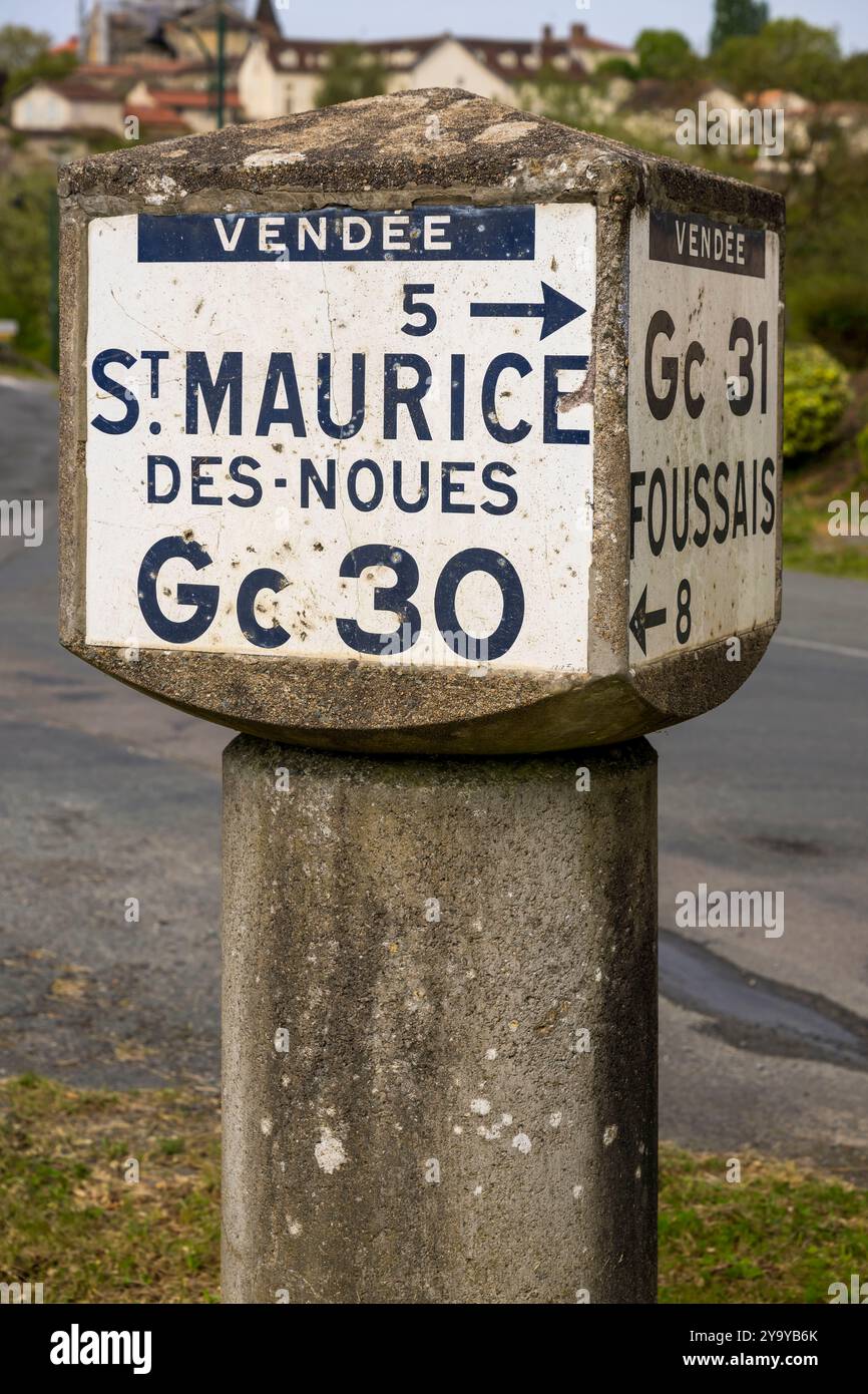 France, Vendee, Vouvant, labelled Les Plus Beaux Villages de France (The Most Beautiful Villages of France), Michelin marker, old road signs Stock Photo