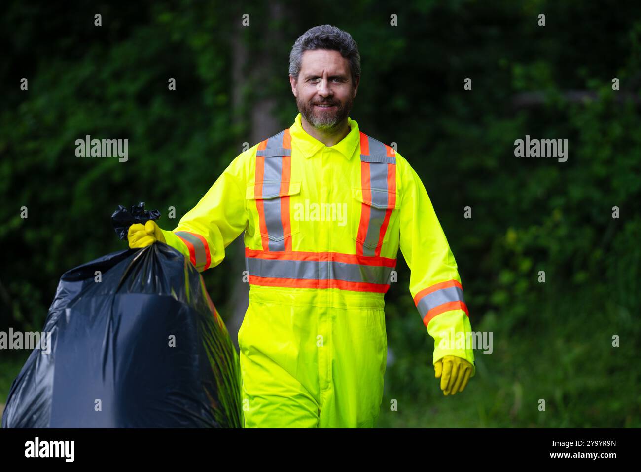 Volunteer man collecting trash outside. Ecology concept. Environmental ...