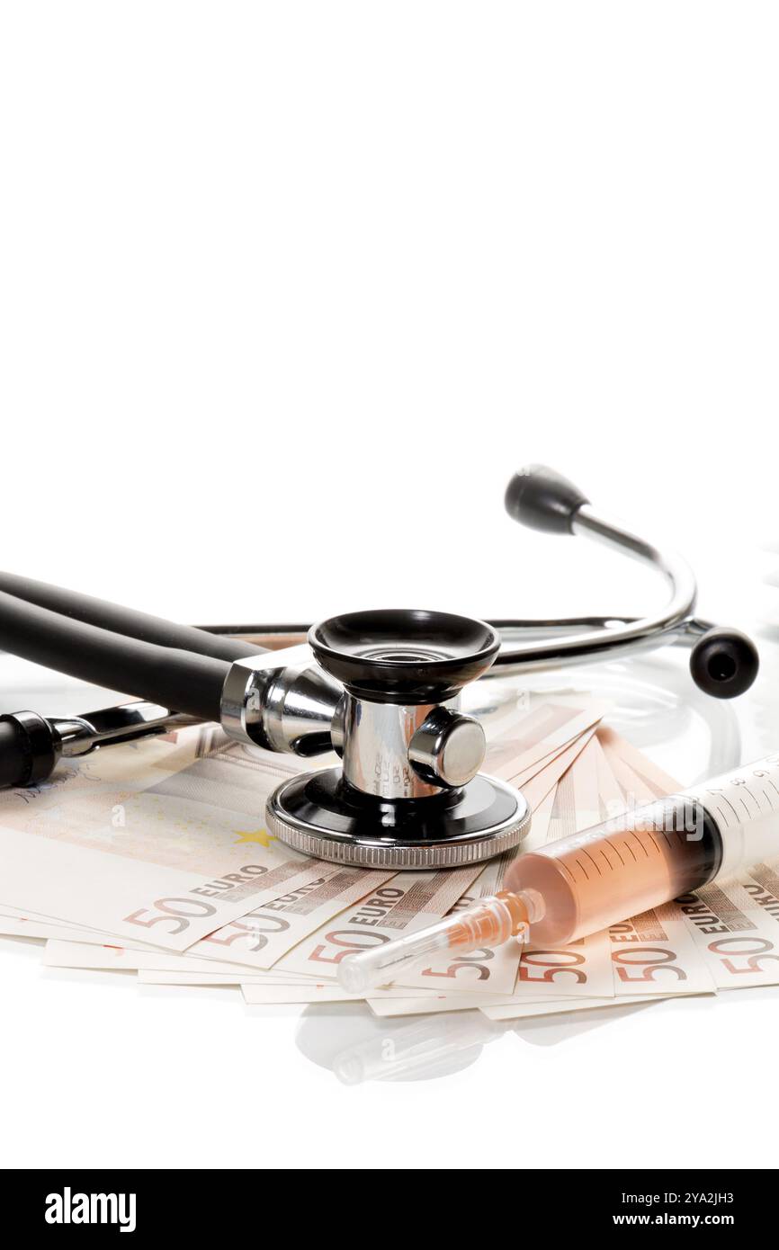 Stethoscope and syringe are on 50 euro notes Stock Photo