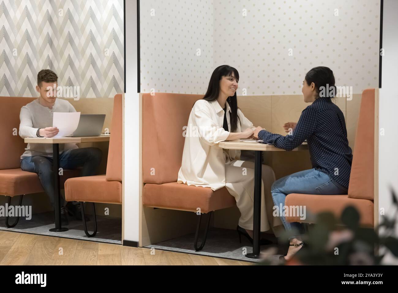 Diverse entrepreneurs, freelancers working in shared office Stock Photo