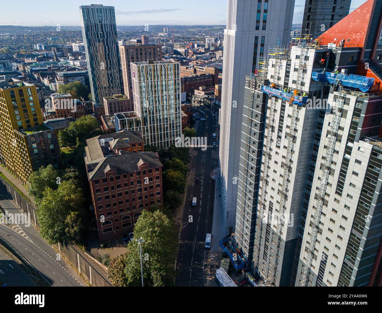 Aerial image of  construction workers at the top of a high rise in Leeds, United Kingdom. Stock Photo