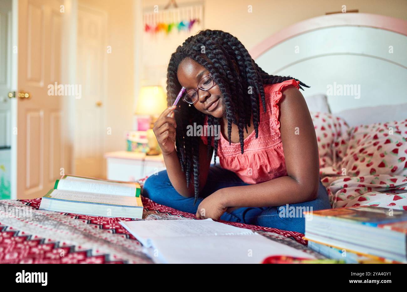 Bedroom, homework and black girl with education, thinking and books ...
