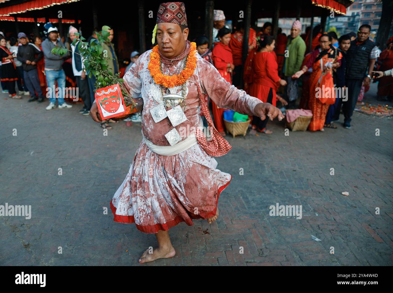 Bhaktapur, Nepal. 12th Oct, 2024. A priest covered in blood stains ...