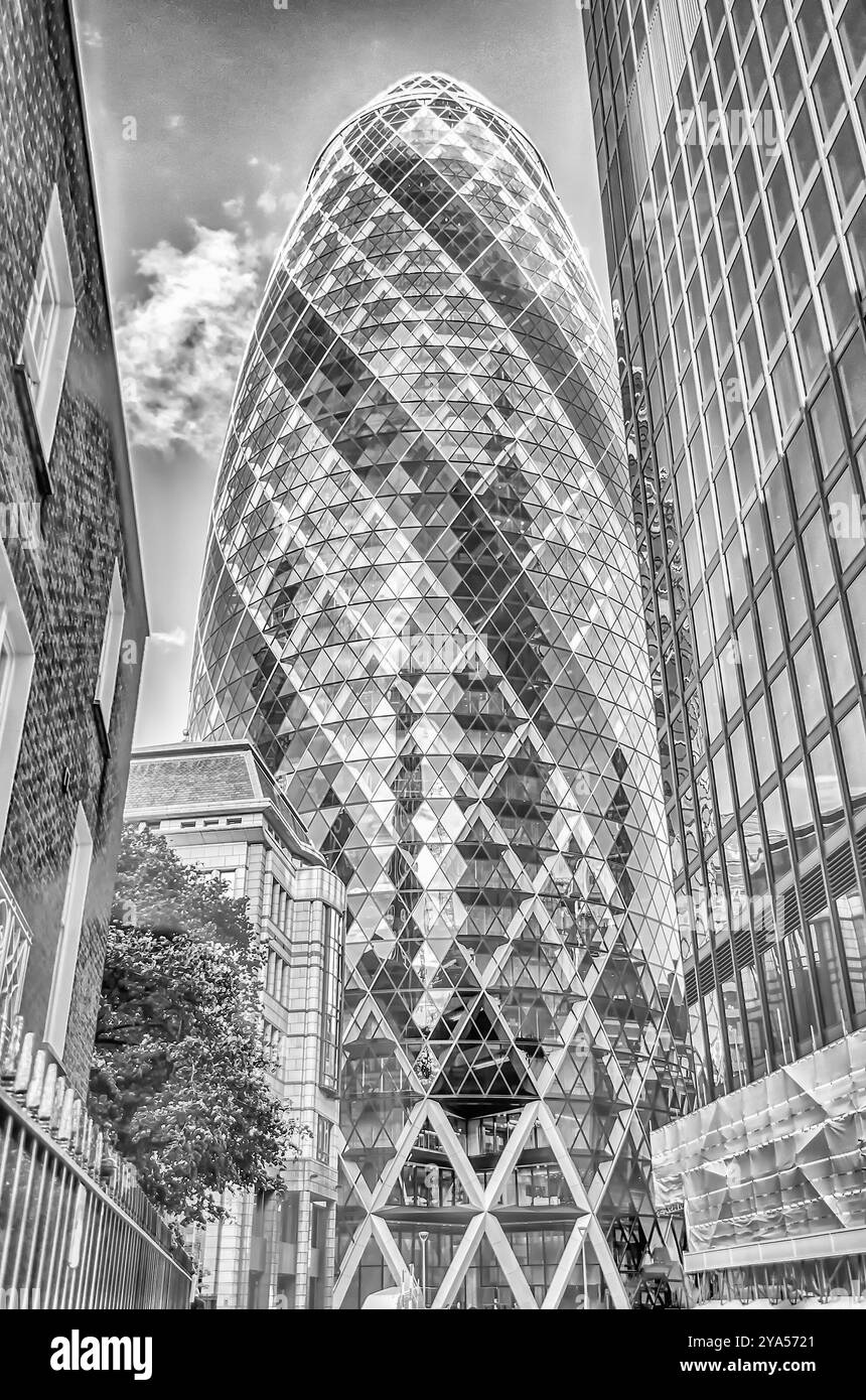 LONDON - MAY 29: The Gherkin building (30 St Mary Axe) in London on May 29, 2015. Iconic landmark of London, this is one of the city's most widely rec Stock Photo