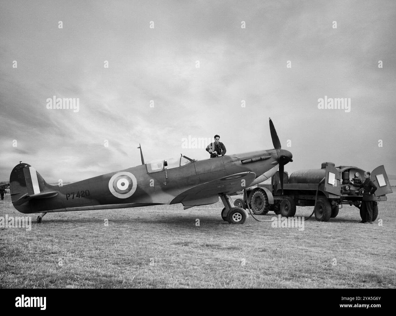 The Supermarine Spitfire Mark IIA being refuelled at No. 19 Squadron was powered by the more powerful Merlin XII increased speed to 377 mph entering service in 1939. The British single-seat fighter aircraft was used by the Royal Air Force and other Allied countries before, during, and after World War II. It was the only British fighter produced continuously throughout the war, albeit in many marks (versions). Stock Photo