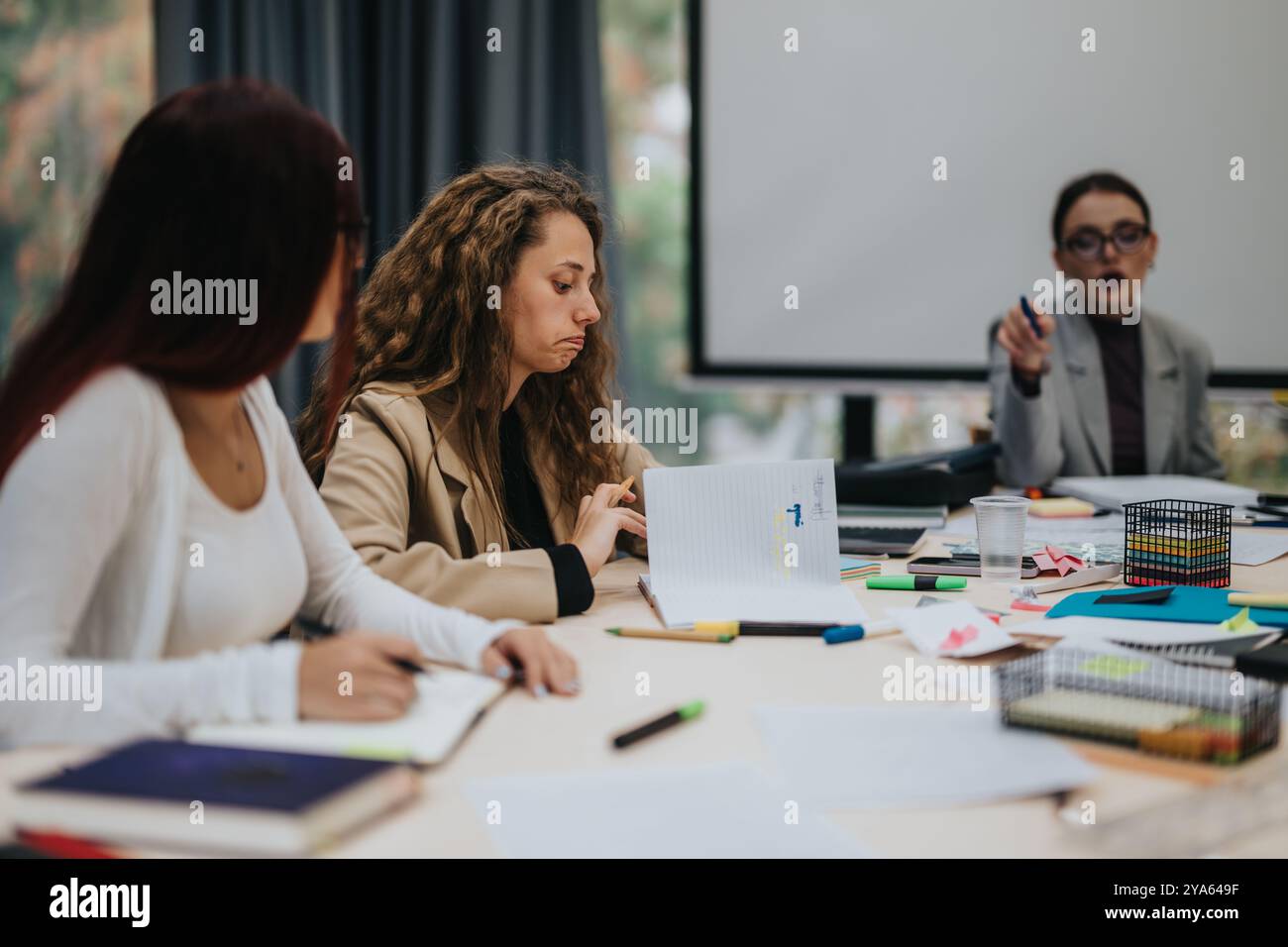 Students participating in a collaborative learning classroom environment Stock Photo