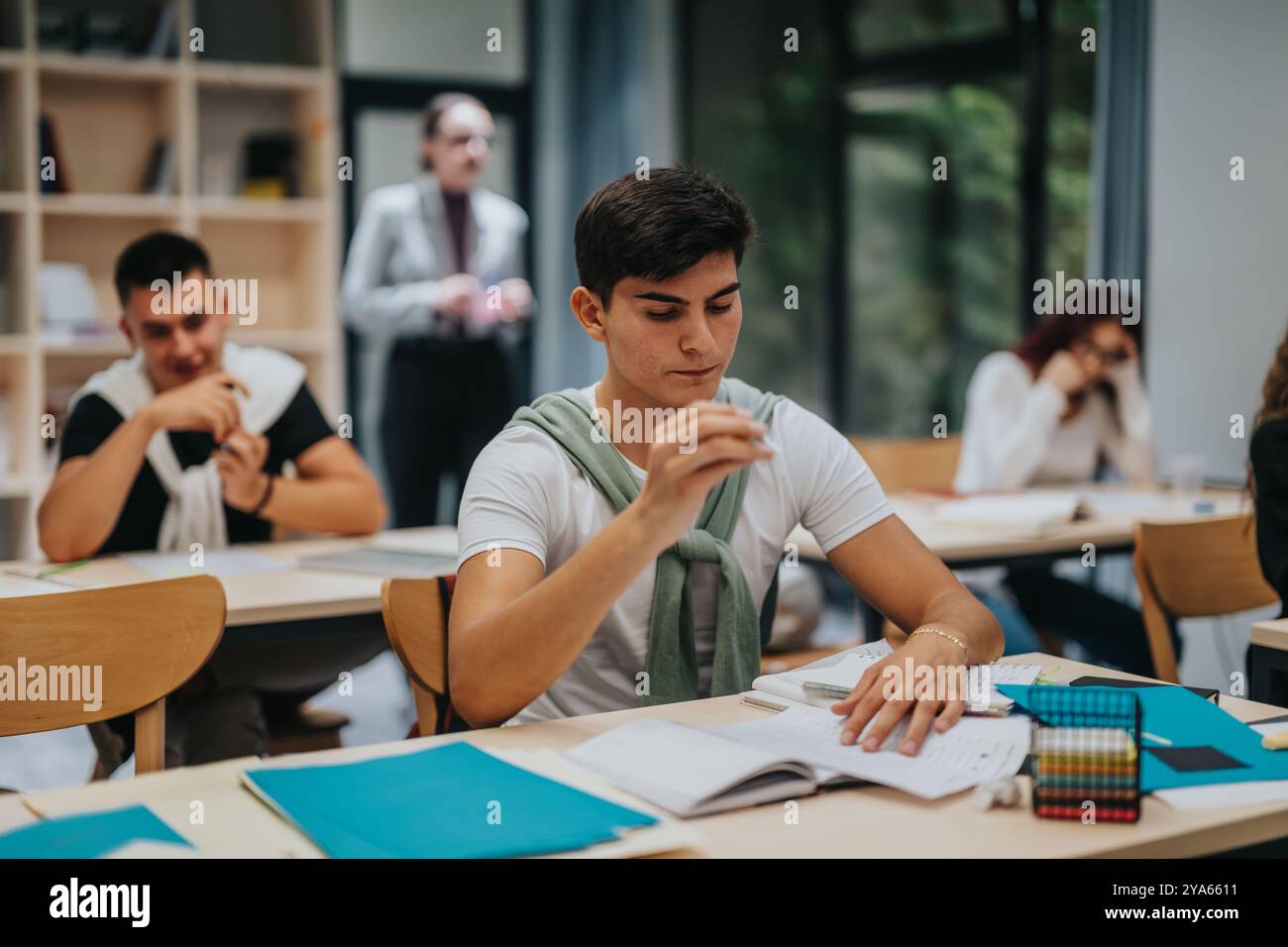 Focused students engaged in classroom learning environment Stock Photo