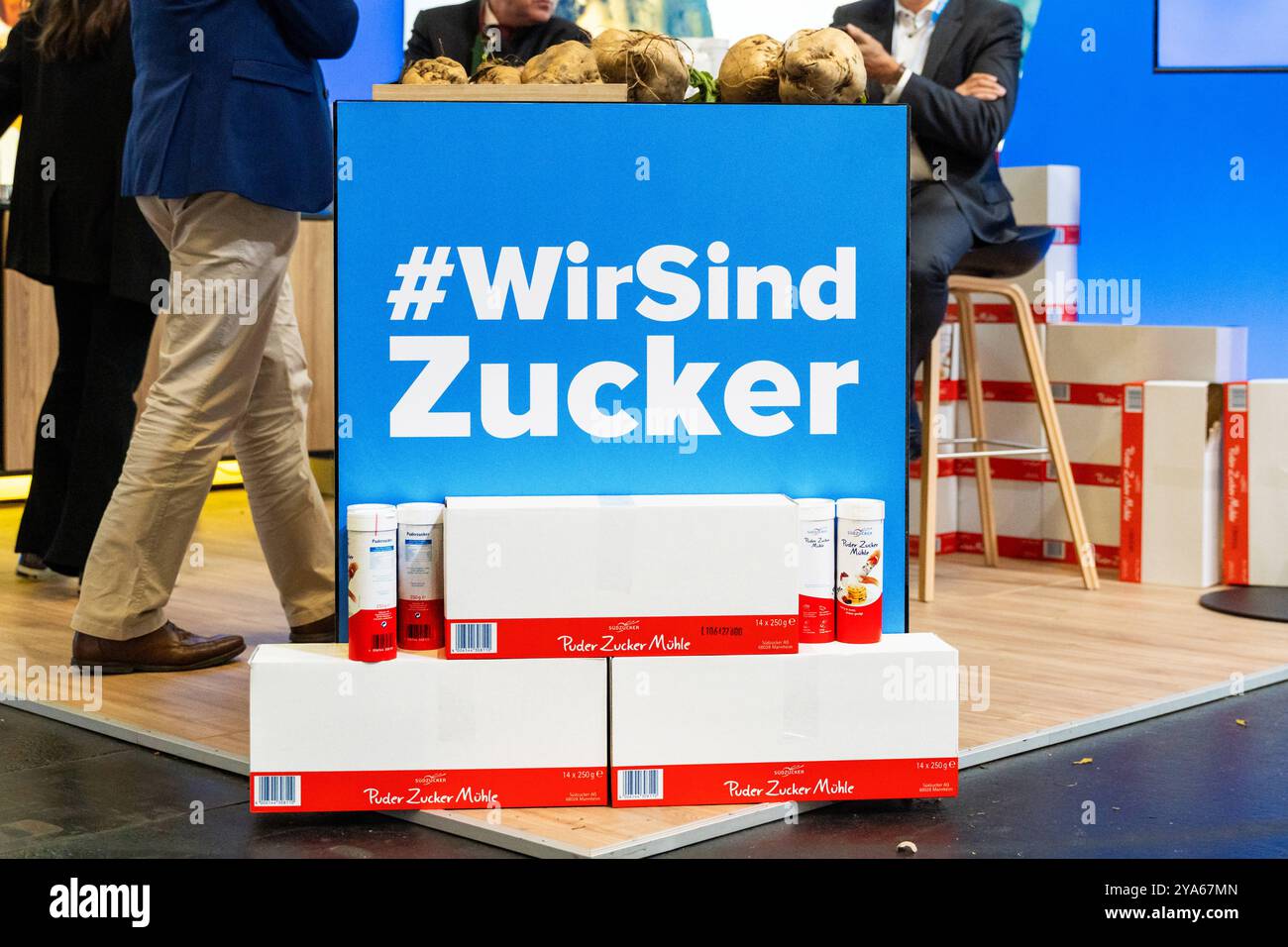 Augsburg, Bavaria, Germany - October 11, 2024: Südzucker exhibition stand at the CSU party conference.The stand advertises the benefits of beet sugar, including sustainable and regional production, with large banners *** Südzucker-Messestand beim CSU-Parteitag. Der Stand wirbt mit großflächigen Bannern über die Vorteile von Rübenzucker, darunter nachhaltige und regionale Produktion Stock Photo