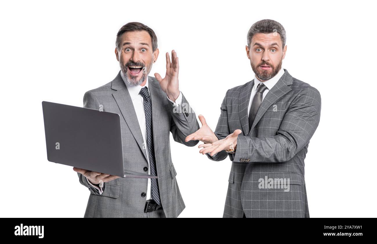 photo of amazed businessmen freelancer with laptop. two businessmen freelancer using laptop. Stock Photo